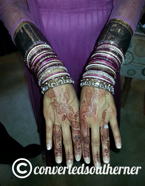 Bridal henna on hands, and you can see it going up to her elbows.