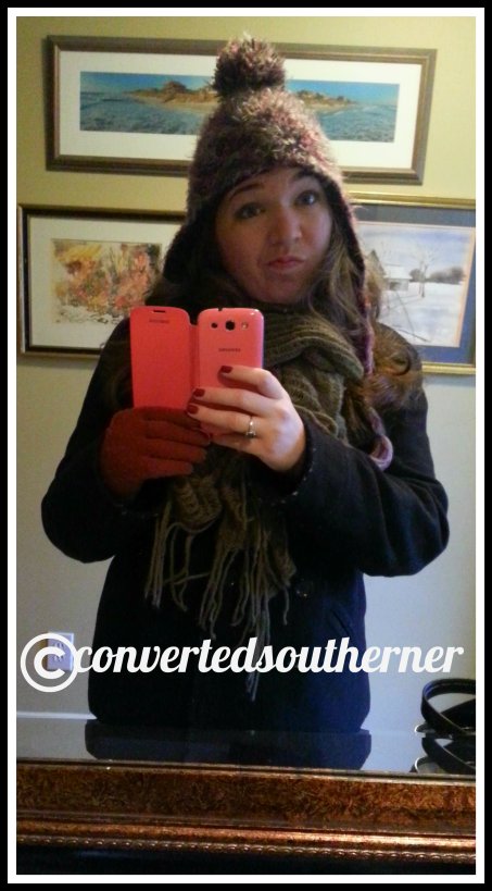 Bundled up in my warmest coat, hat gloves and scarf. I was not amused with the cold weather!