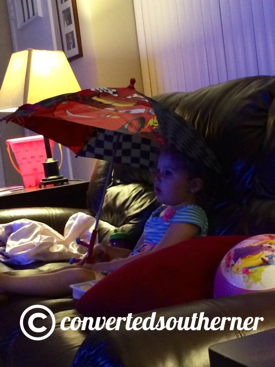 Lili.. Chilling with her umbrella. July 2014. Three year olds are funny. 