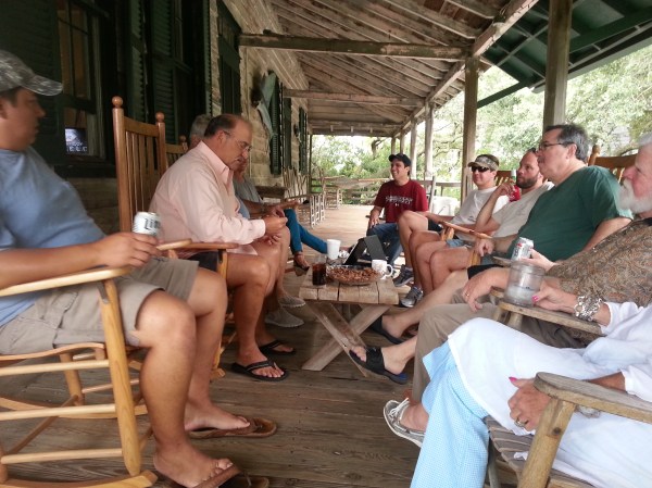 Hanging on the porch of the beach house with friends and family.... notice hammocks at both ends and LOTs of rocking chairs. 