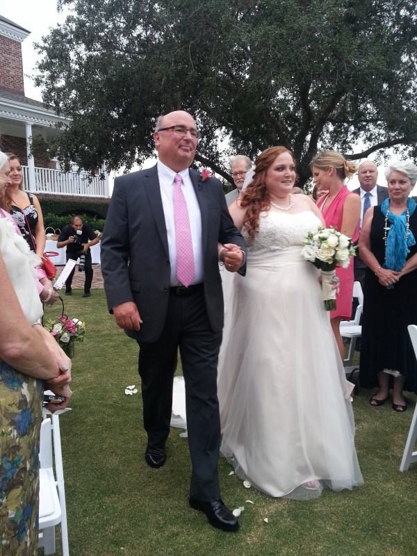 The bride walking down the aisle with her Dad