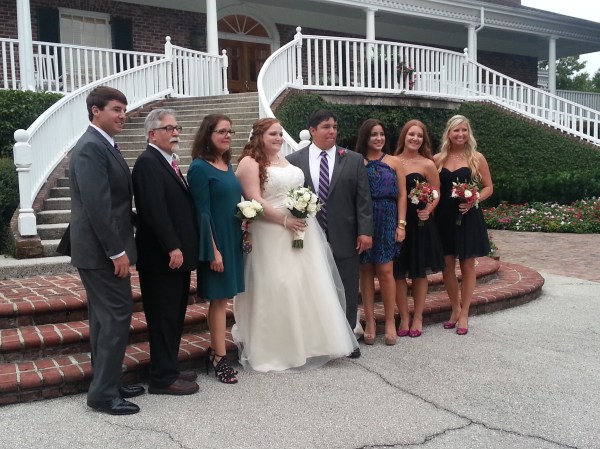 The Bride and groom with his mom, step-dad, sisters, brother and sister-in-law. I already loved Emily, but I loved her a little bit more during all these family pictures... she was issuing directions like a boss- just like I would!