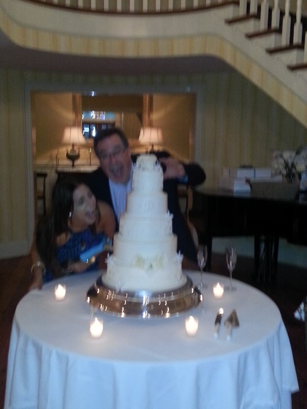My Dad and Hayden, sister of the groom, goofing off around the cake. 