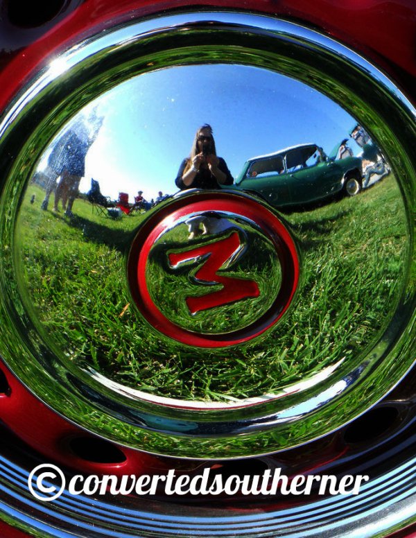 Me, reflected in tire cap, at the European Car Show in 2011.
